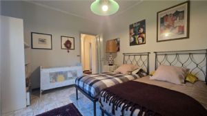 APPARTAMENTO IN VILLA CON GIARDINO E BOX